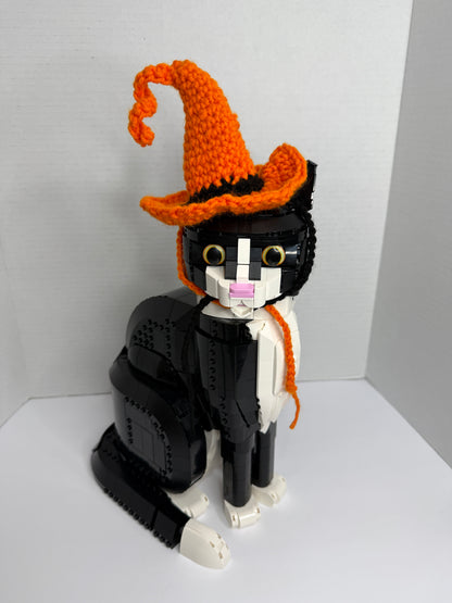 Cat toy with orange crochet witch hat