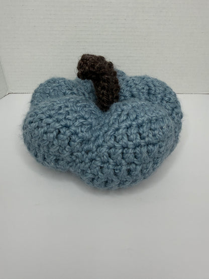 Crochet blue pumpkin on a white background