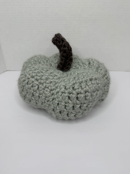 Crochet gray pumpkin on a white background