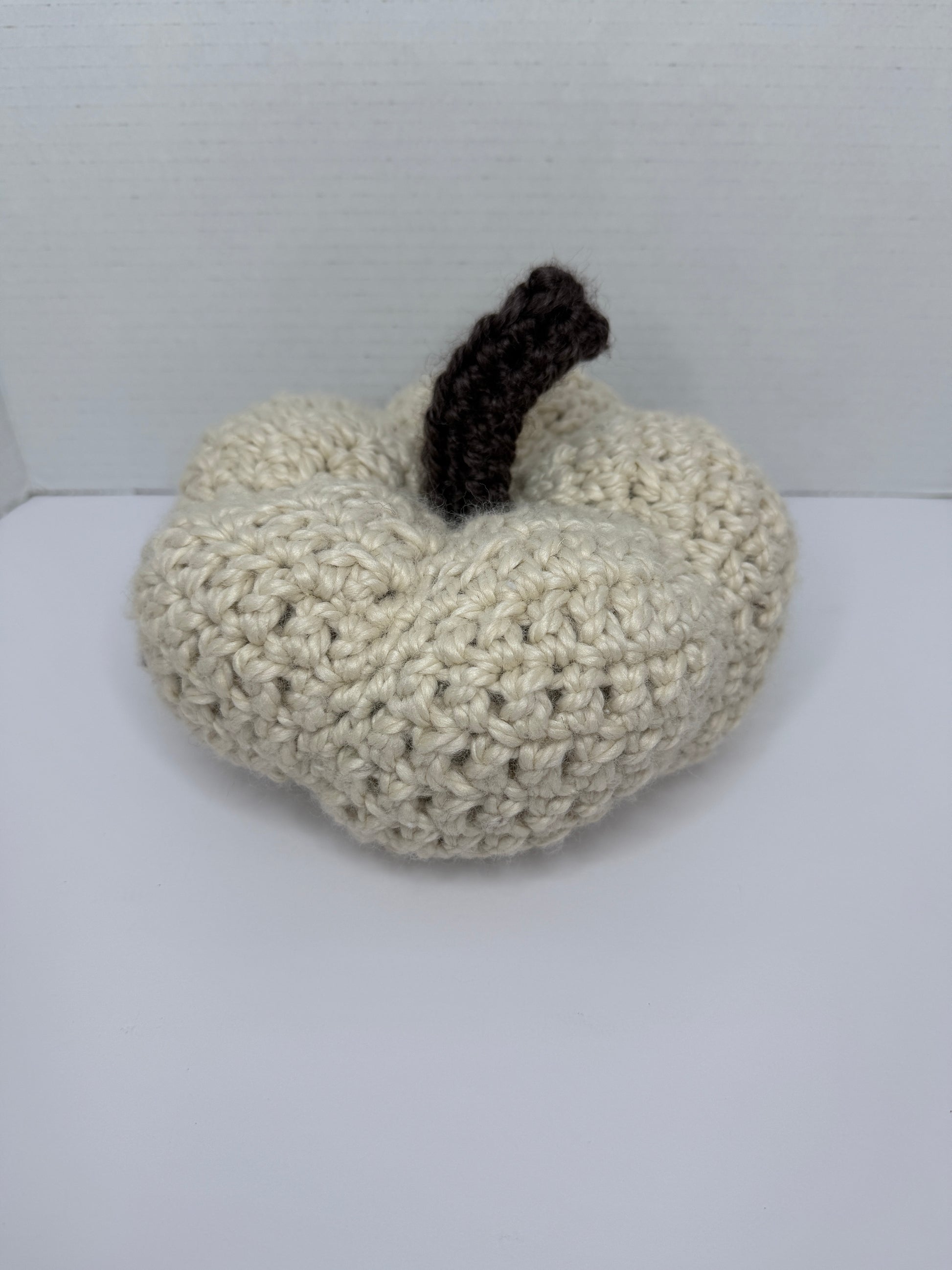Crochet white pumpkin on a white background